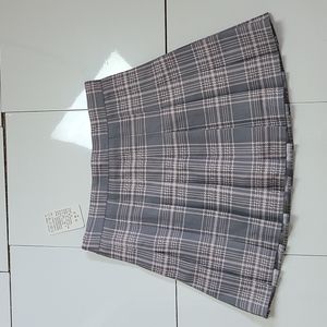 A gray and light pink plaid skirt